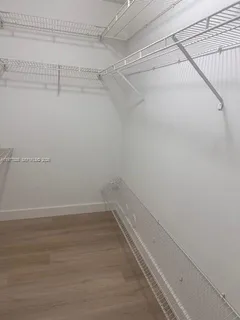 a view of a room with racks on the wall