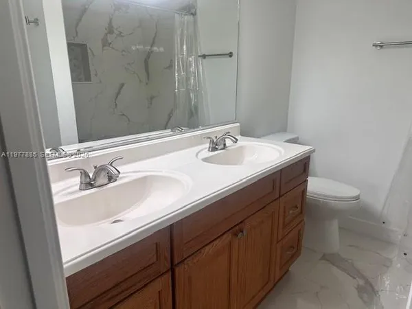 a bathroom with a sink and a toilet