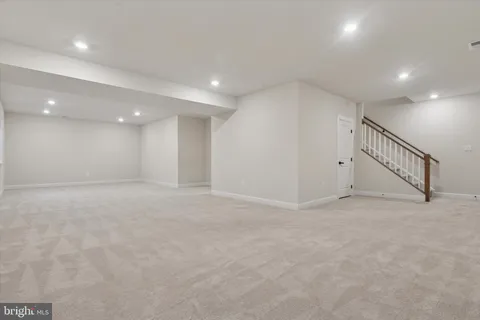 a bathroom with a double vanity sink toilet and shower