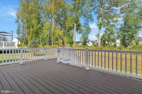 an aerial view of residential house with green space
