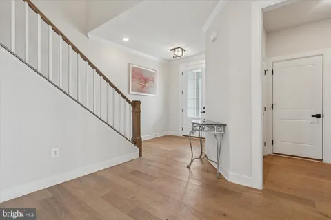a view of an entryway with wooden floor