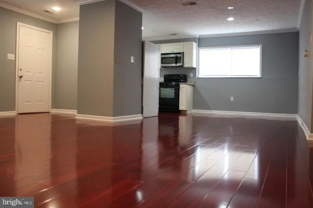 a view of a kitchen with a sink and a window