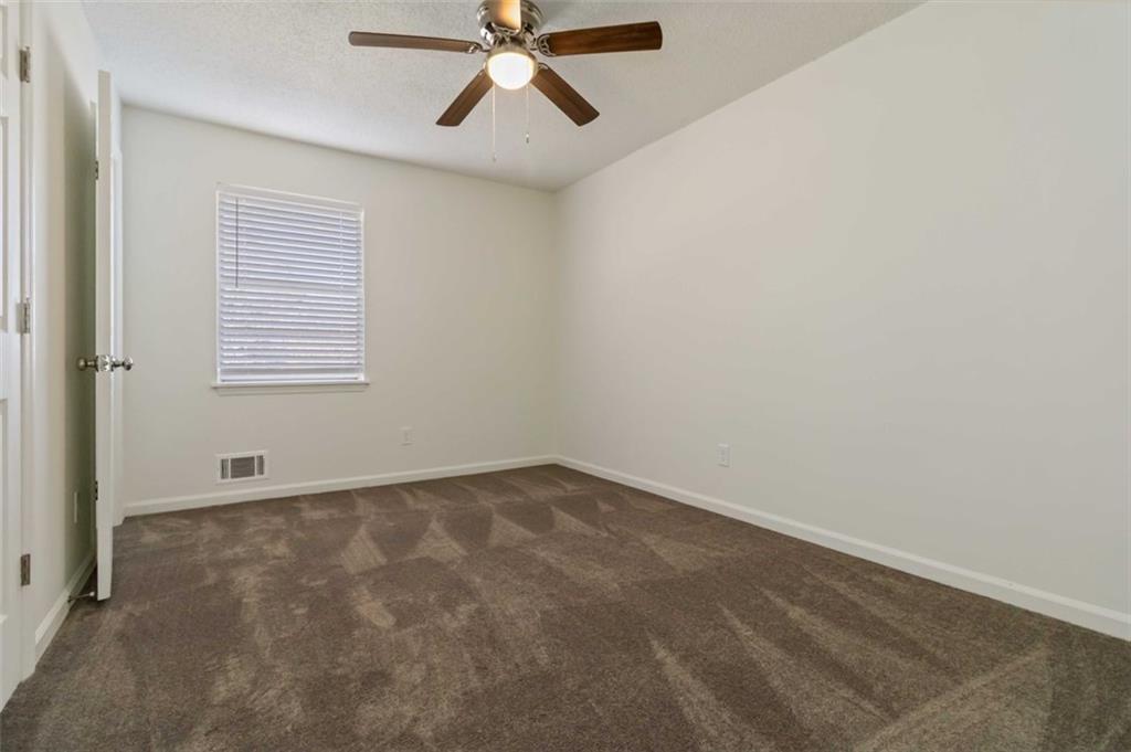 1535 Lake Jodeco Road Jonesboro, GA 30236 - Photo 18 of 45 an empty room with a window and a fan
