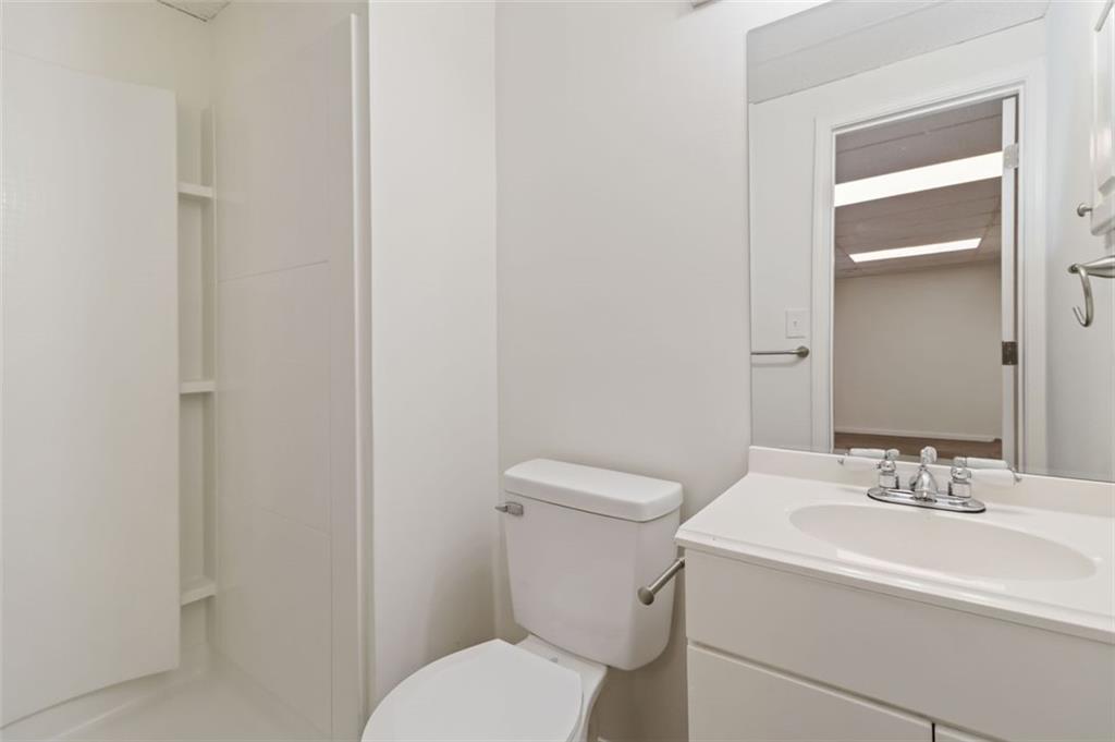 1535 Lake Jodeco Road Jonesboro, GA 30236 - Photo 22 of 45 a bathroom with a sink toilet and a mirror