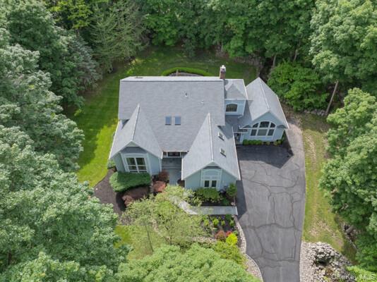 19 West Gate Road Suffern, NY 10901 - Photo 9 of 42 Expansive property featuring a multi-gabled roofline, light blue siding, and abundant surrounding greenery