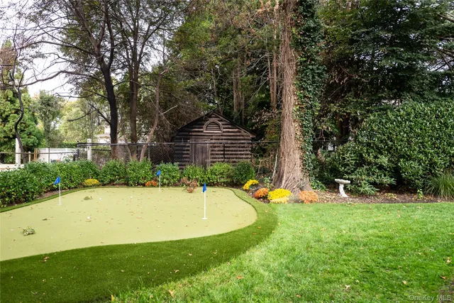 a view of a backyard with a fountain