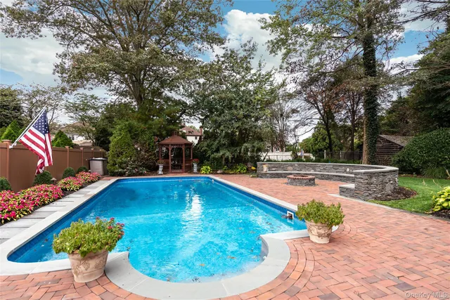 a view of a swimming pool with a patio