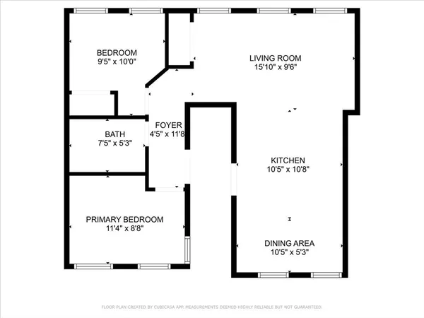 a front view of a building with trees