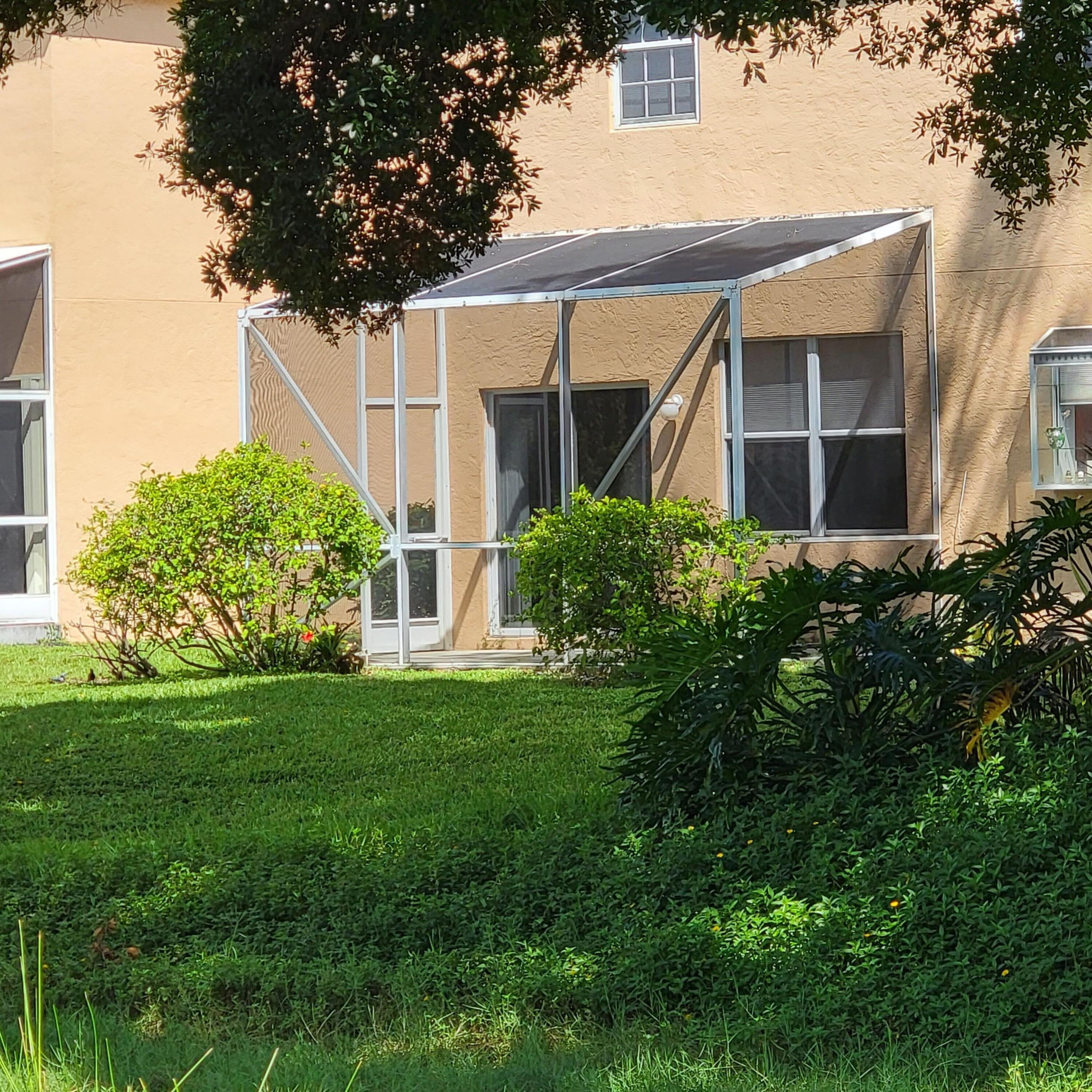 348 Laurel Oaks Way Jupiter, FL 33458 - Photo 3 of 6 Screened in patio-South exposure