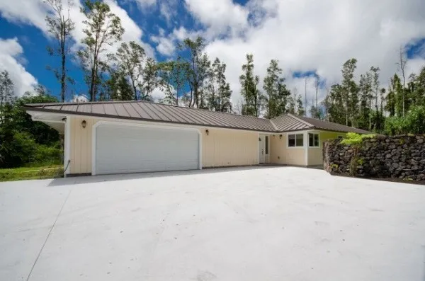 a view of garage and yard
