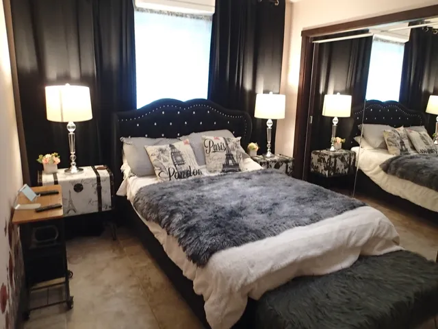 a bedroom with bed and window