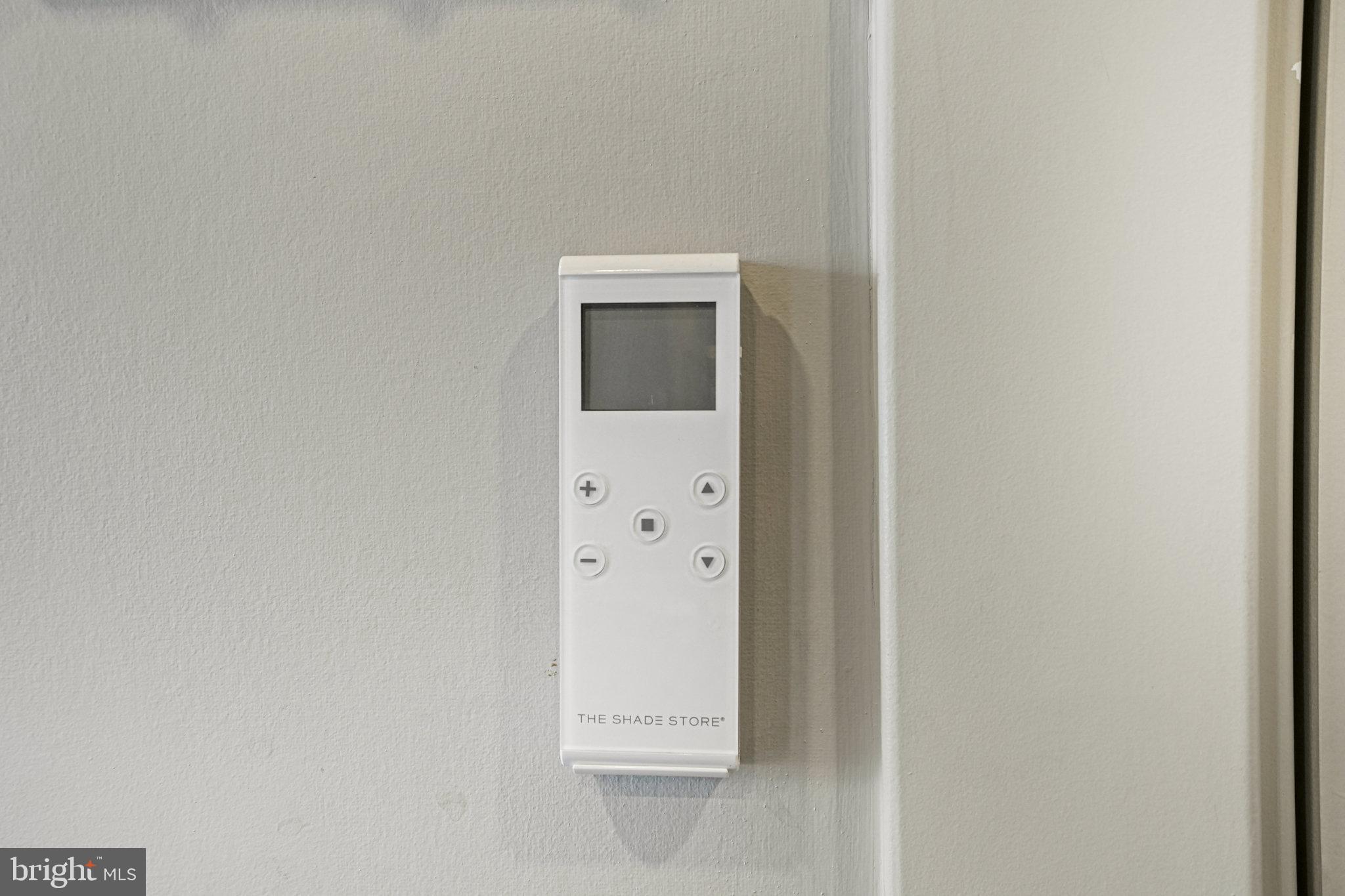 1301 H Street Northeast, Unit 1 Washington, DC 20002 - Photo 22 of 39 Remote control for the shades in the main room.