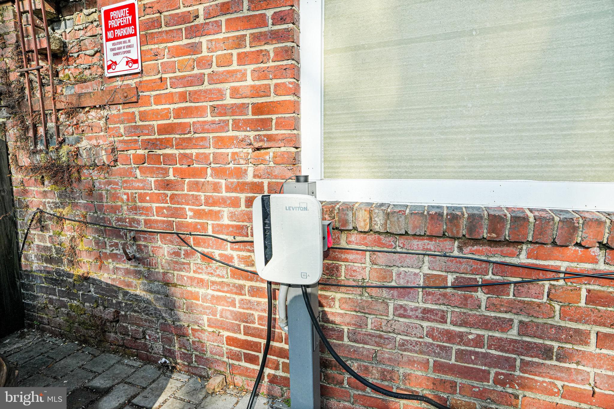 1301 H Street Northeast, Unit 1 Washington, DC 20002 - Photo 24 of 39 EV charging station at the conveyed parking space.