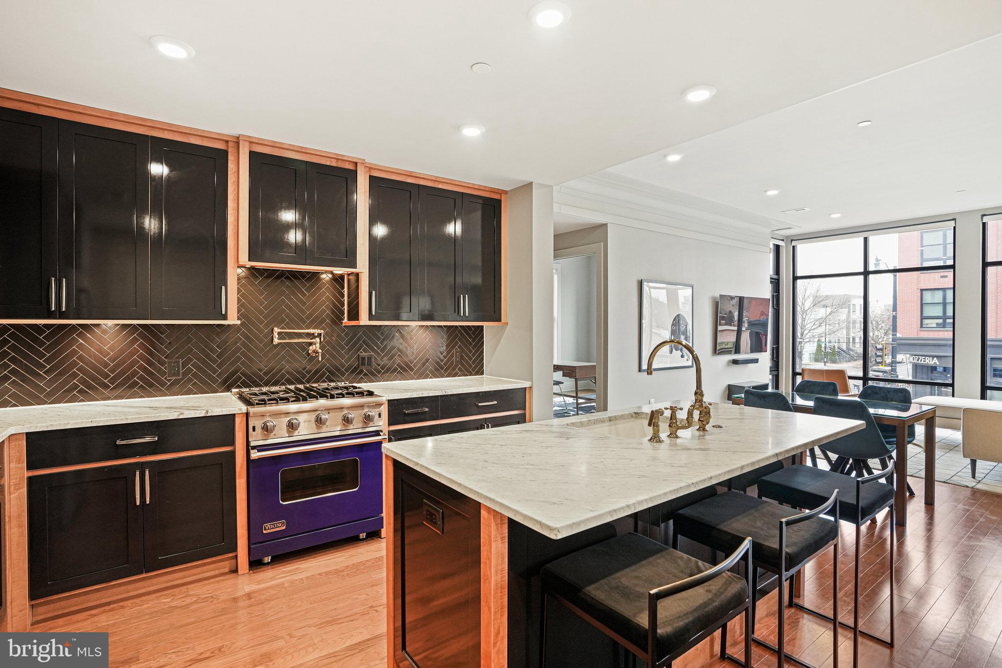 1301 H Street Northeast, Unit 1 Washington, DC 20002 - Photo 2 of 39 Marble countertops and custom cabinetry.