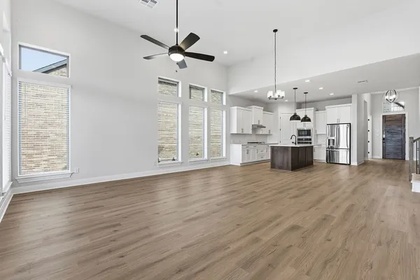a view of a kitchen with a stove cabinets and wooden floor