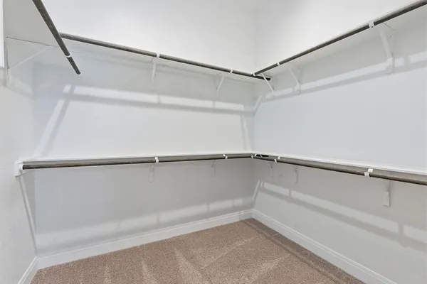 a view of an empty walk in closet