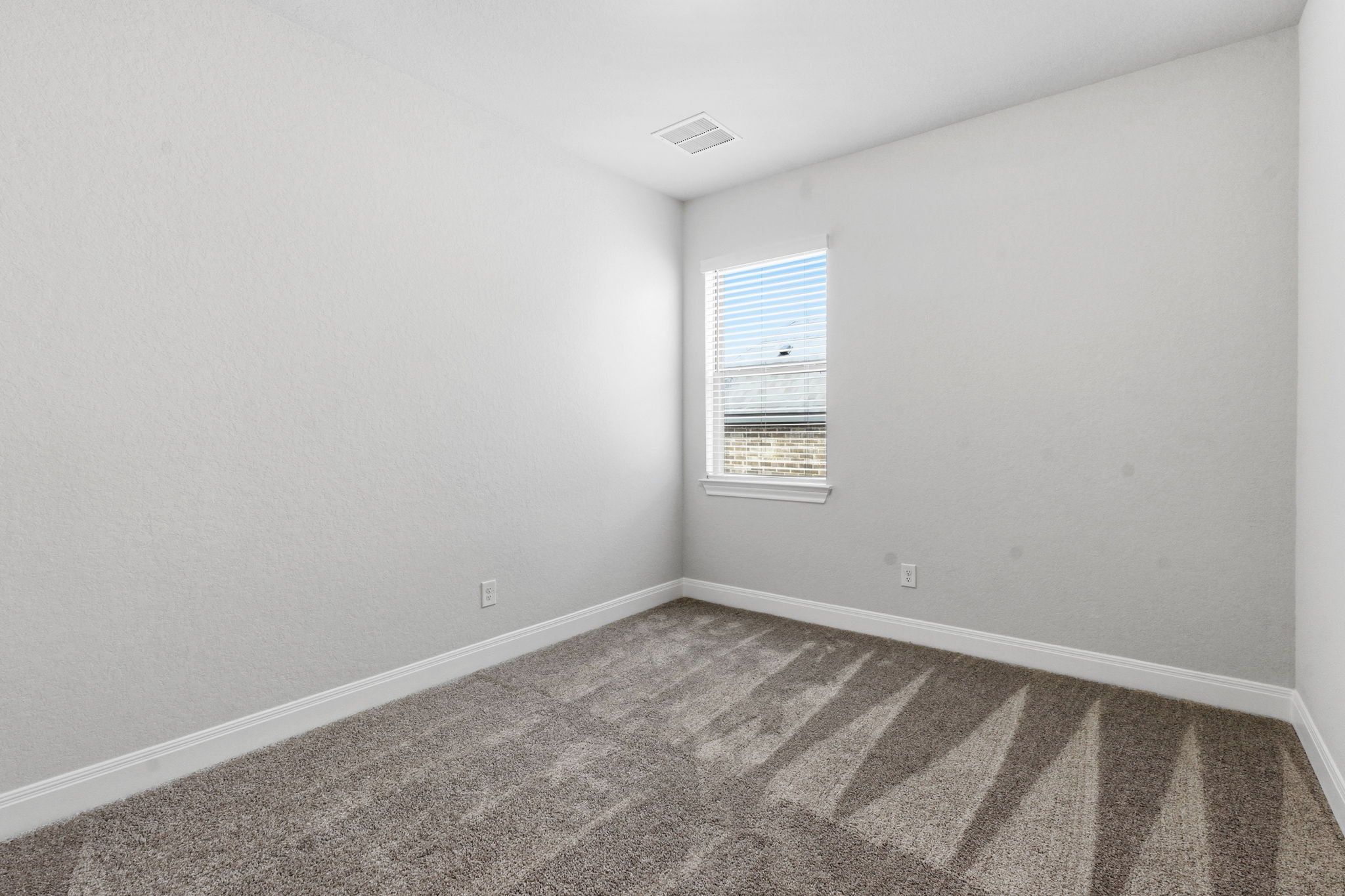 276 Prickly Poppy Loop Kyle, TX 78640 - Photo 29 of 38 Carpeted spare room with baseboards