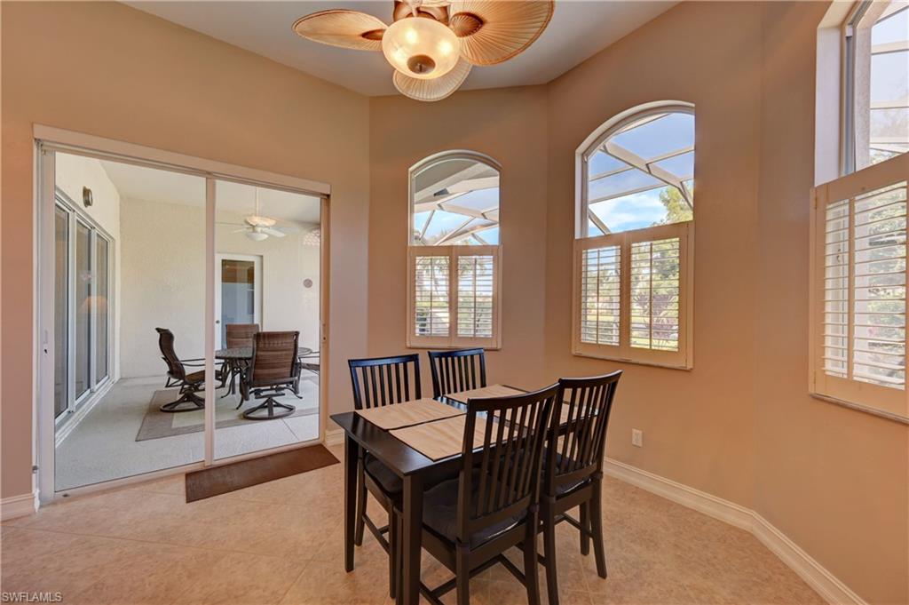 12518 Grandezza Circle Estero, FL 33928 - Photo 11 of 33 a view of a dining room with furniture and chandelier