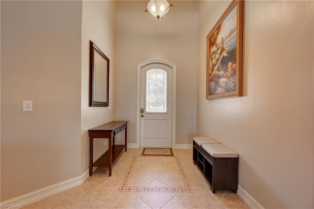 12518 Grandezza Circle Estero, FL 33928 - Photo 3 of 33 a room with painting and a table