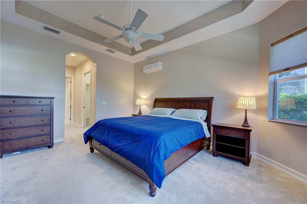 12518 Grandezza Circle Estero, FL 33928 - Photo 22 of 33 a bedroom with a bed and a dresser