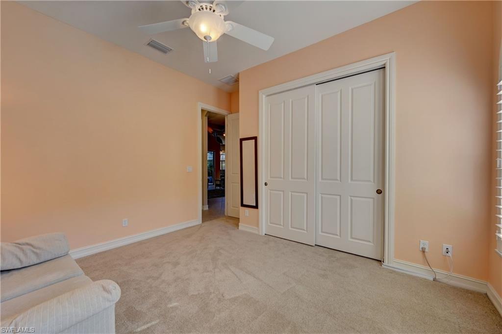 12518 Grandezza Circle Estero, FL 33928 - Photo 24 of 33 an empty room with a ceiling fan
