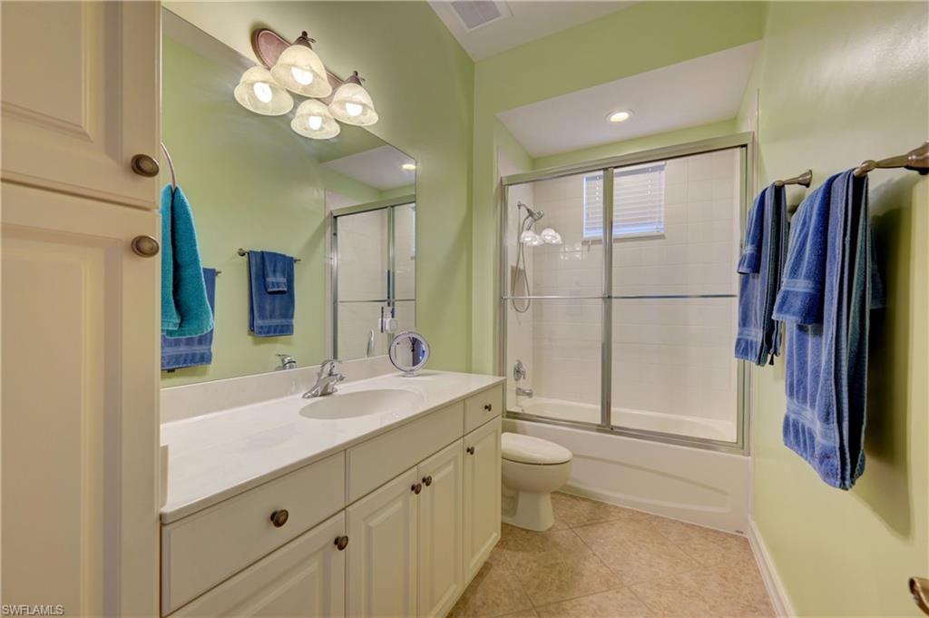 12518 Grandezza Circle Estero, FL 33928 - Photo 26 of 33 a bathroom with a double vanity sink mirror and shower