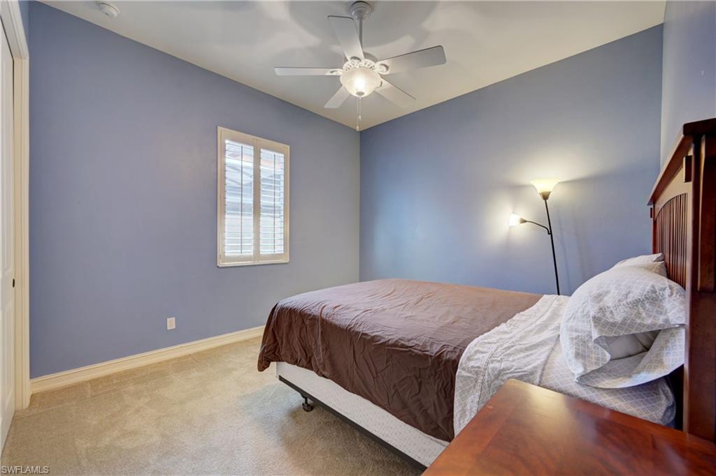 12518 Grandezza Circle Estero, FL 33928 - Photo 29 of 33 a bedroom with a bed and a window