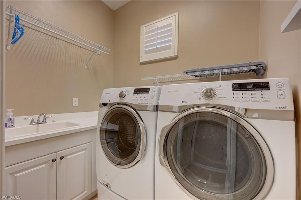 12518 Grandezza Circle Estero, FL 33928 - Photo 31 of 33 a utility room with dryer and washer