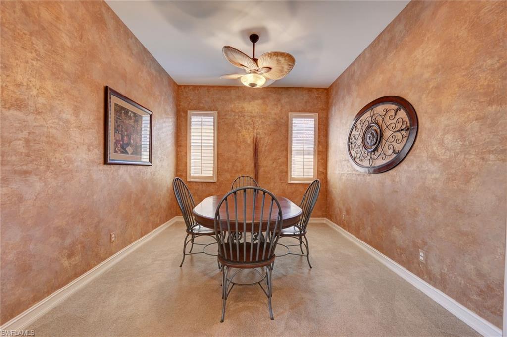 12518 Grandezza Circle Estero, FL 33928 - Photo 5 of 33 a view of a dining room with furniture and a chandelier
