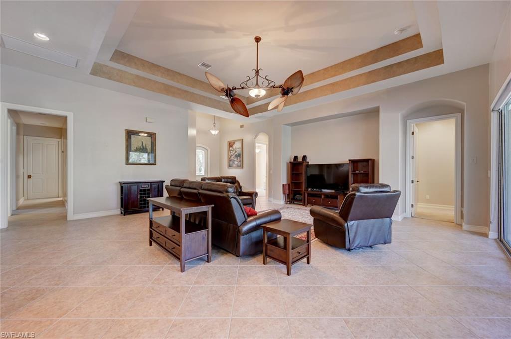 12518 Grandezza Circle Estero, FL 33928 - Photo 6 of 33 a living room with furniture and a flat screen tv
