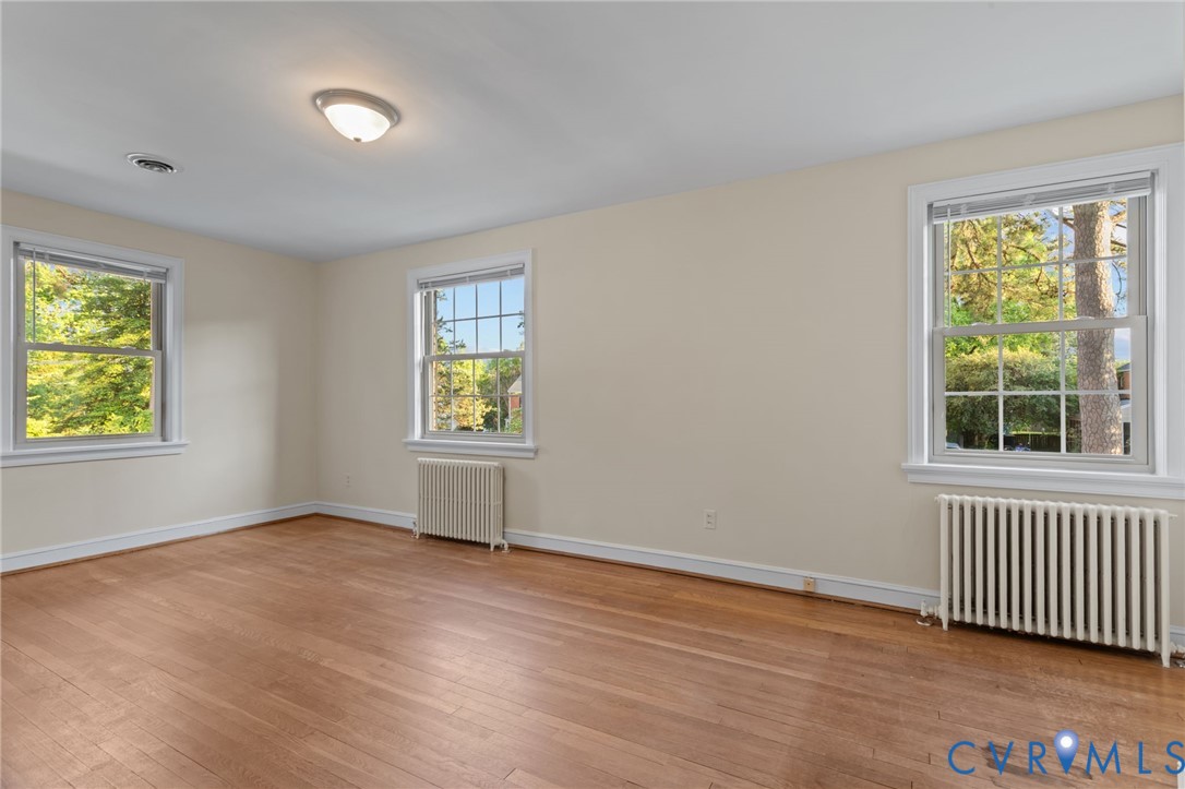 4804 Morrison Road Richmond, VA 23230 - Photo 31 of 48 an empty room with wooden floor and windows