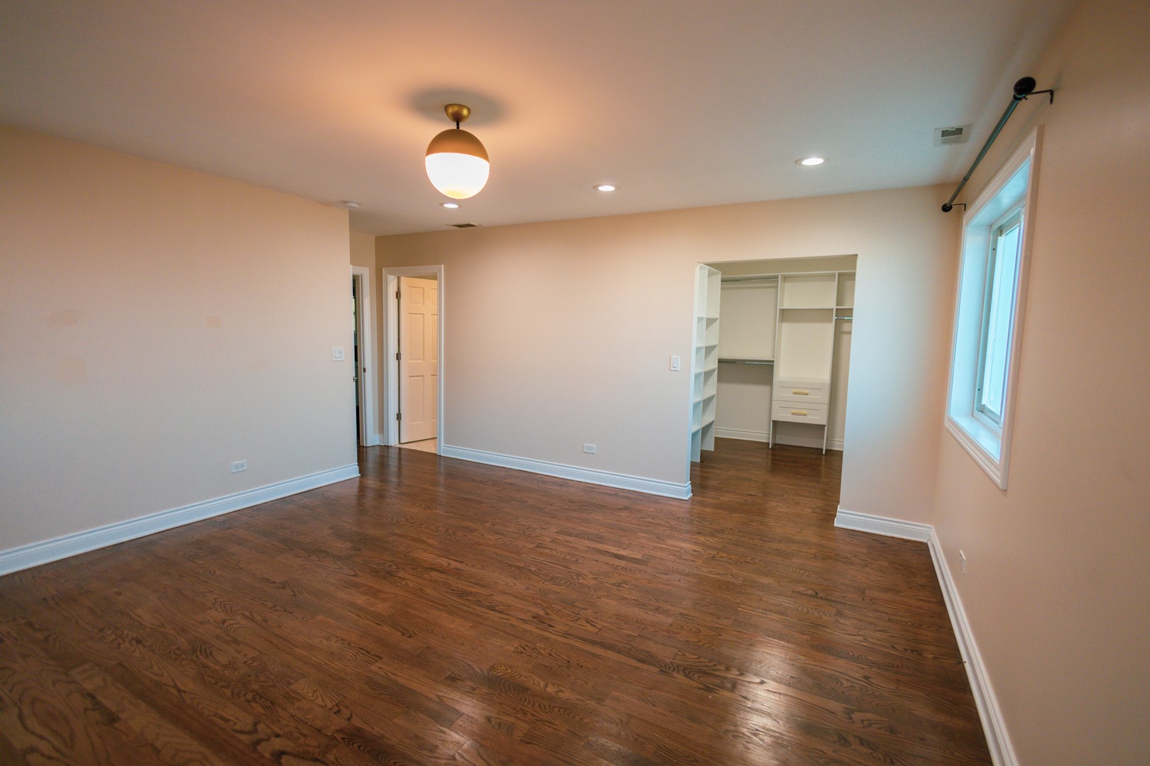 7916 McVicker Avenue Burbank, IL 60459 - Photo 15 of 19 a view of a room with wooden floor and a bathroom