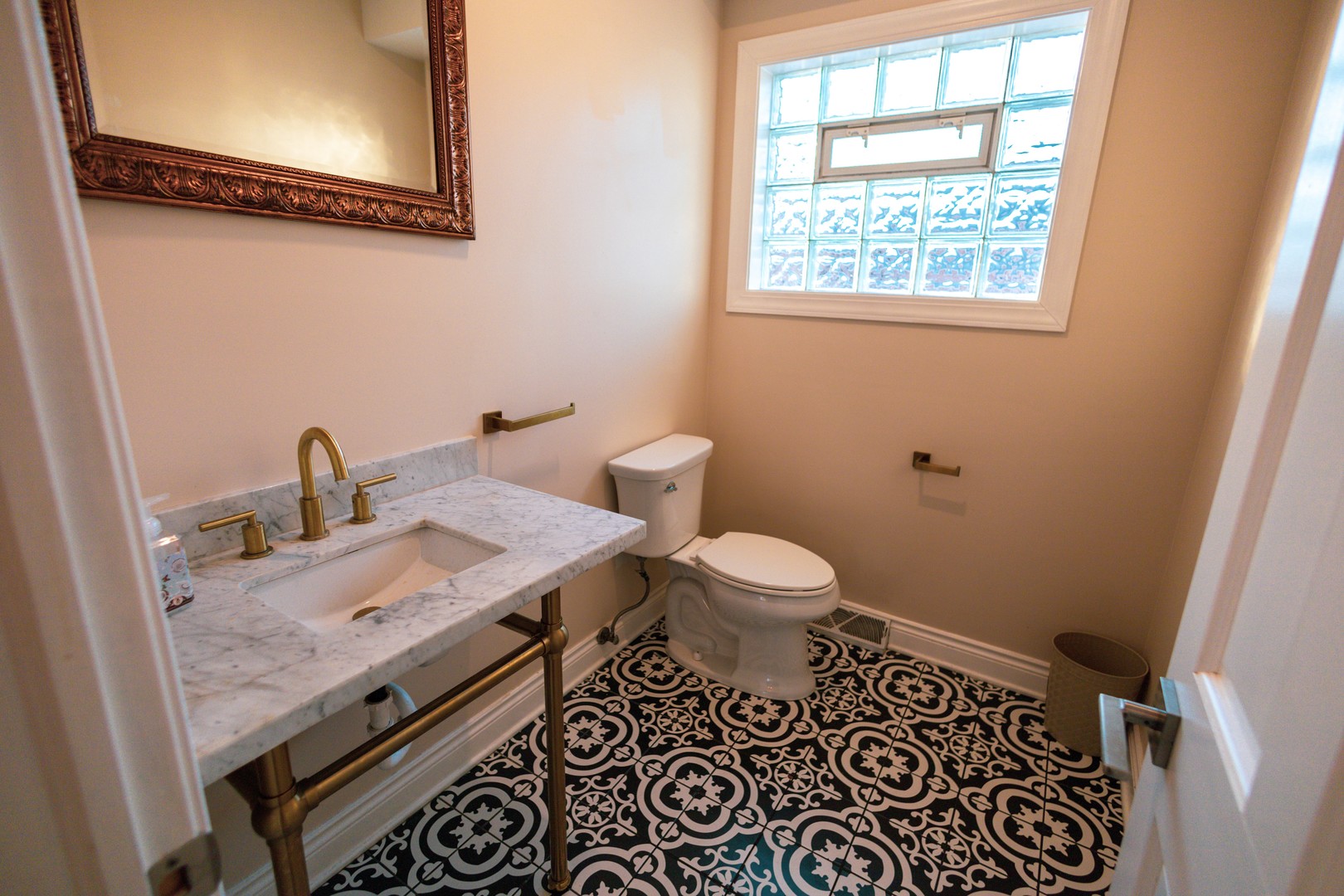 7916 McVicker Avenue Burbank, IL 60459 - Photo 18 of 19 a bathroom with a granite countertop toilet and a sink