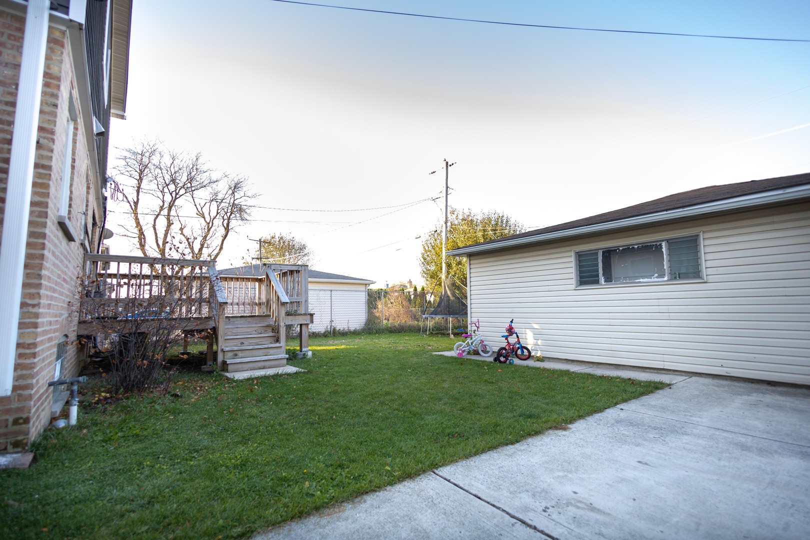 7916 McVicker Avenue Burbank, IL 60459 - Photo 19 of 19 a front view of a house with a garden and yard