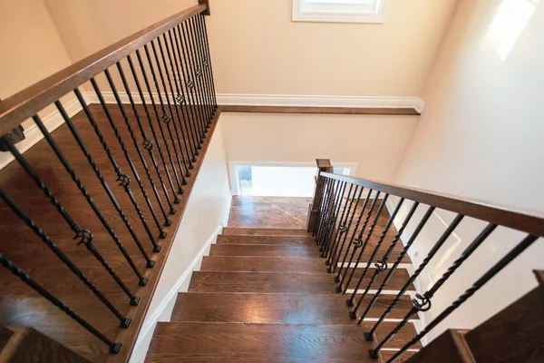 a view of stairs and wooden floor