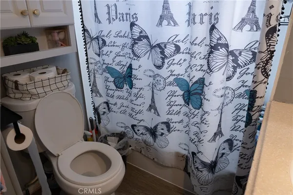 a bathroom with a toilet and a sink