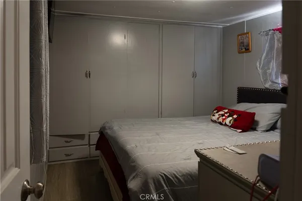a bedroom with a bed and a table