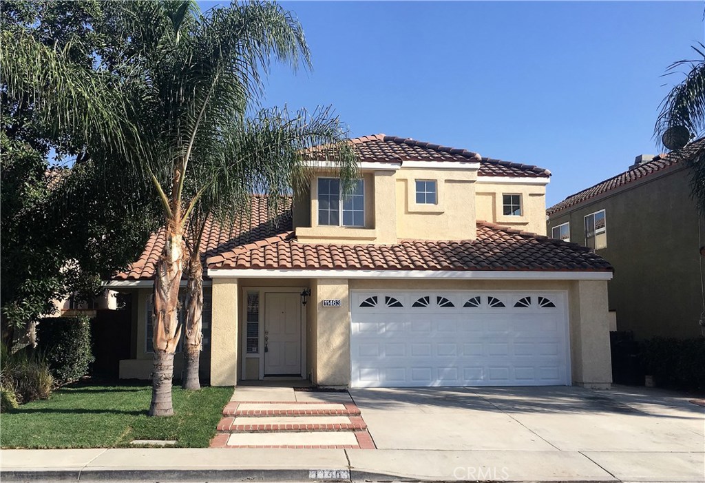 11463 Leatherleaf Road Fontana, CA 92337 - Photo 1 of 1 a front view of a house with a garden
