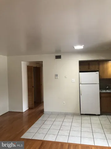a view of a livingroom with a kitchen space