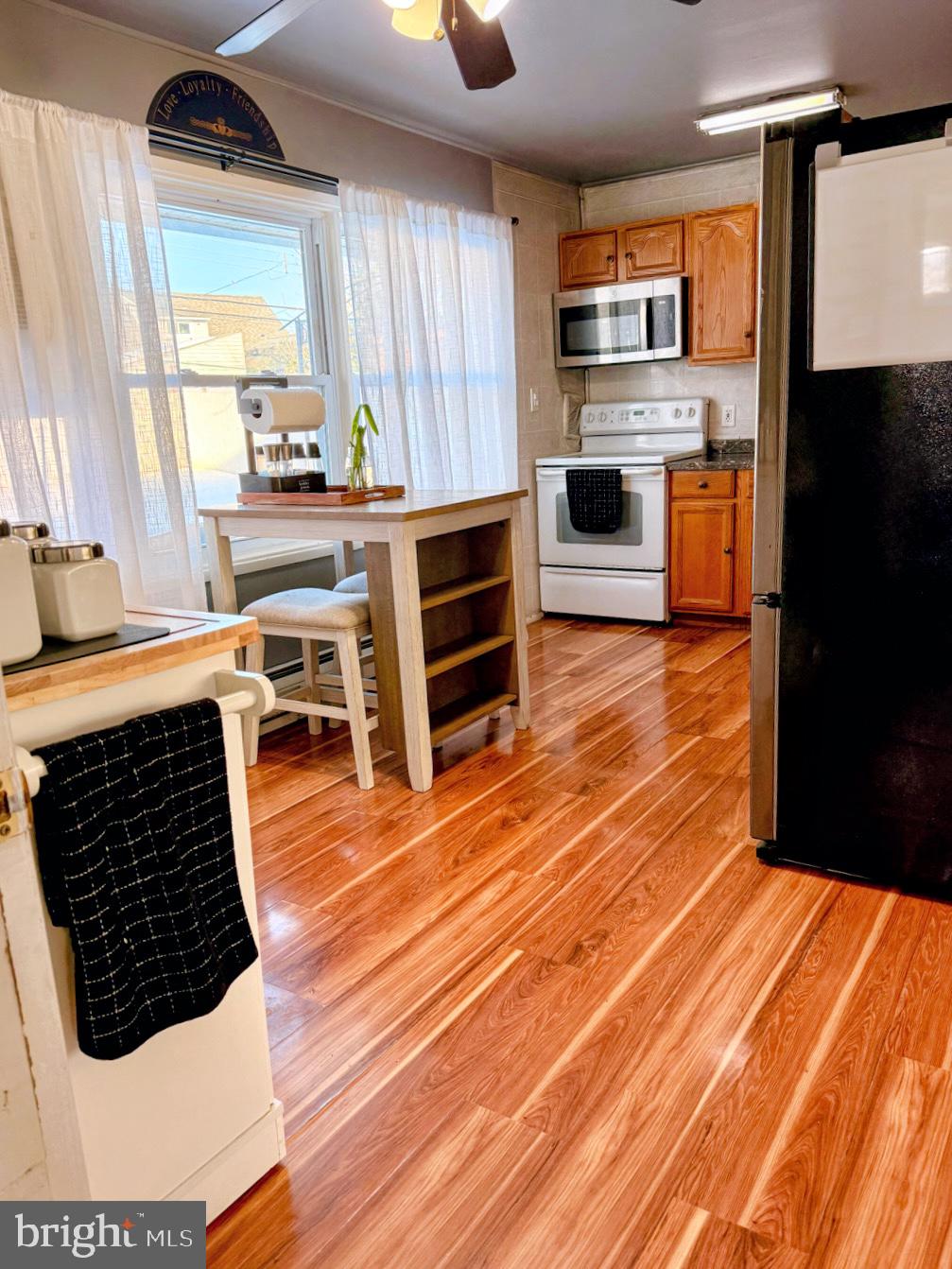 30 Misty Pine Road Levittown, PA 19056 - Photo 4 of 21 a kitchen with stainless steel appliances a stove a sink and a microwave