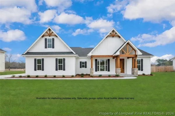 a front view of a house with a yard porch and garden