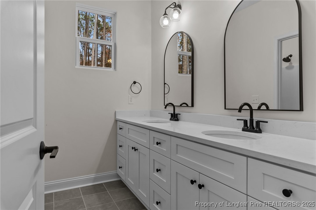 Tbd Doe Hill Road Autryville, NC 28318 - Photo 38 of 47 a bathroom with double vanity sinks and a mirror