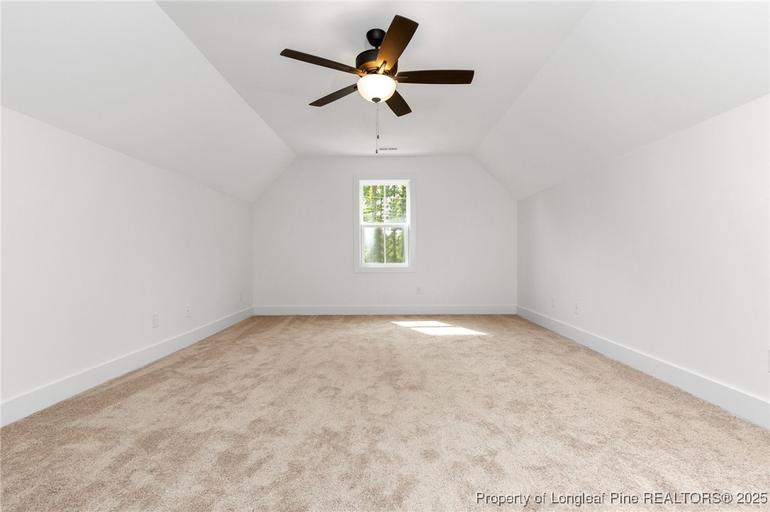 Tbd Doe Hill Road Autryville, NC 28318 - Photo 40 of 44 an empty room with a window and a ceiling fan