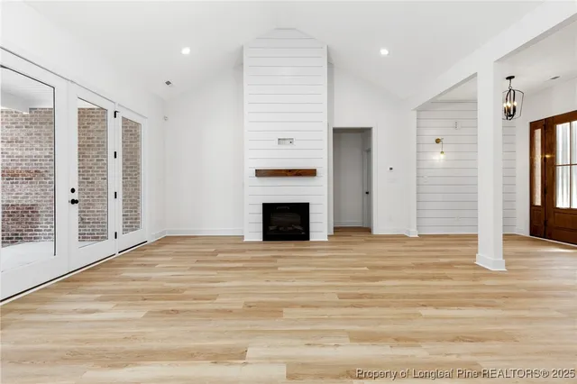 a kitchen with stainless steel appliances kitchen island granite countertop a stove and a microwave