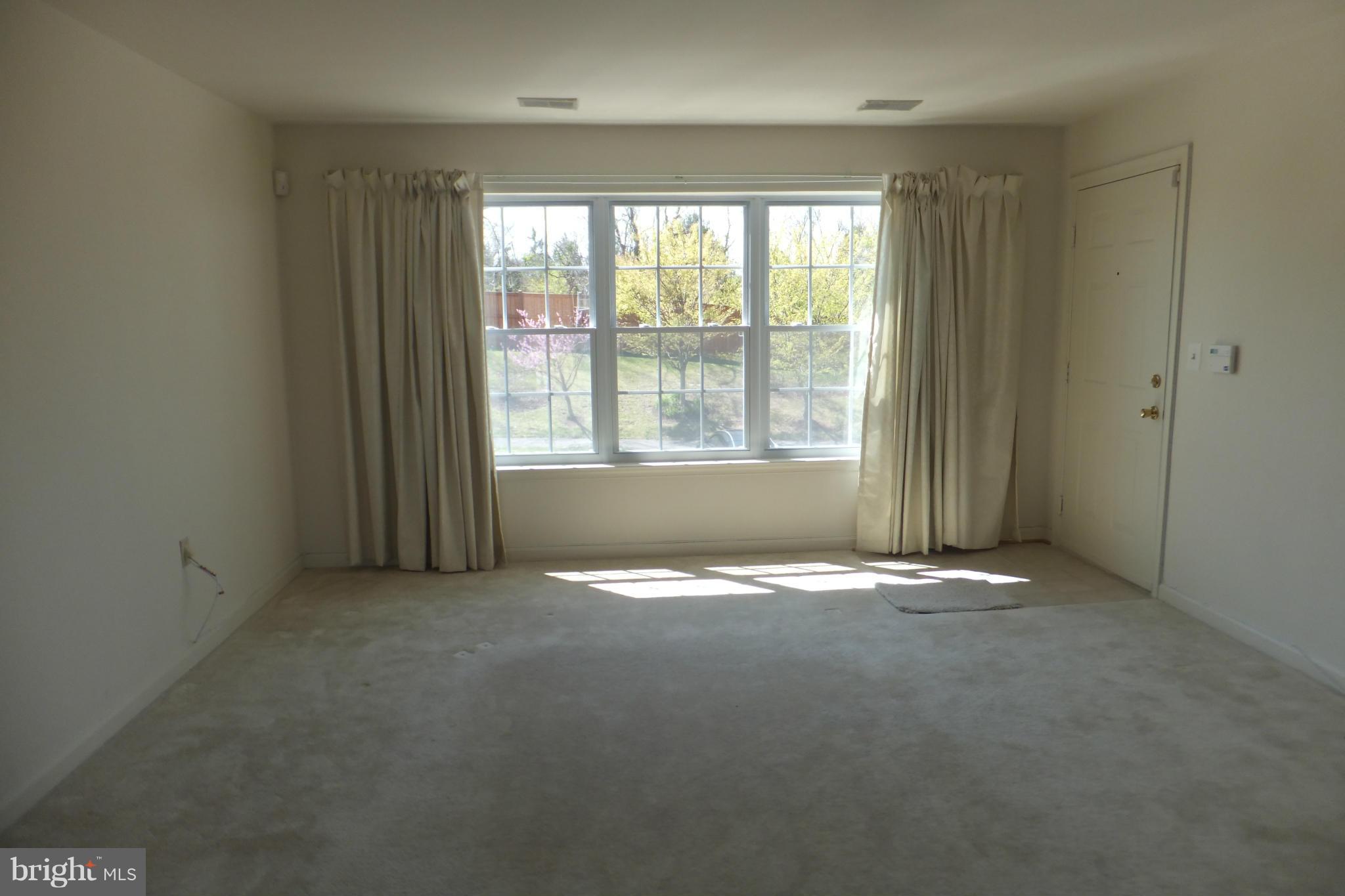 655 Constellation Square Southeast, Unit B Leesburg, VA 20175 - Photo 3 of 13 a view of an empty room with a window