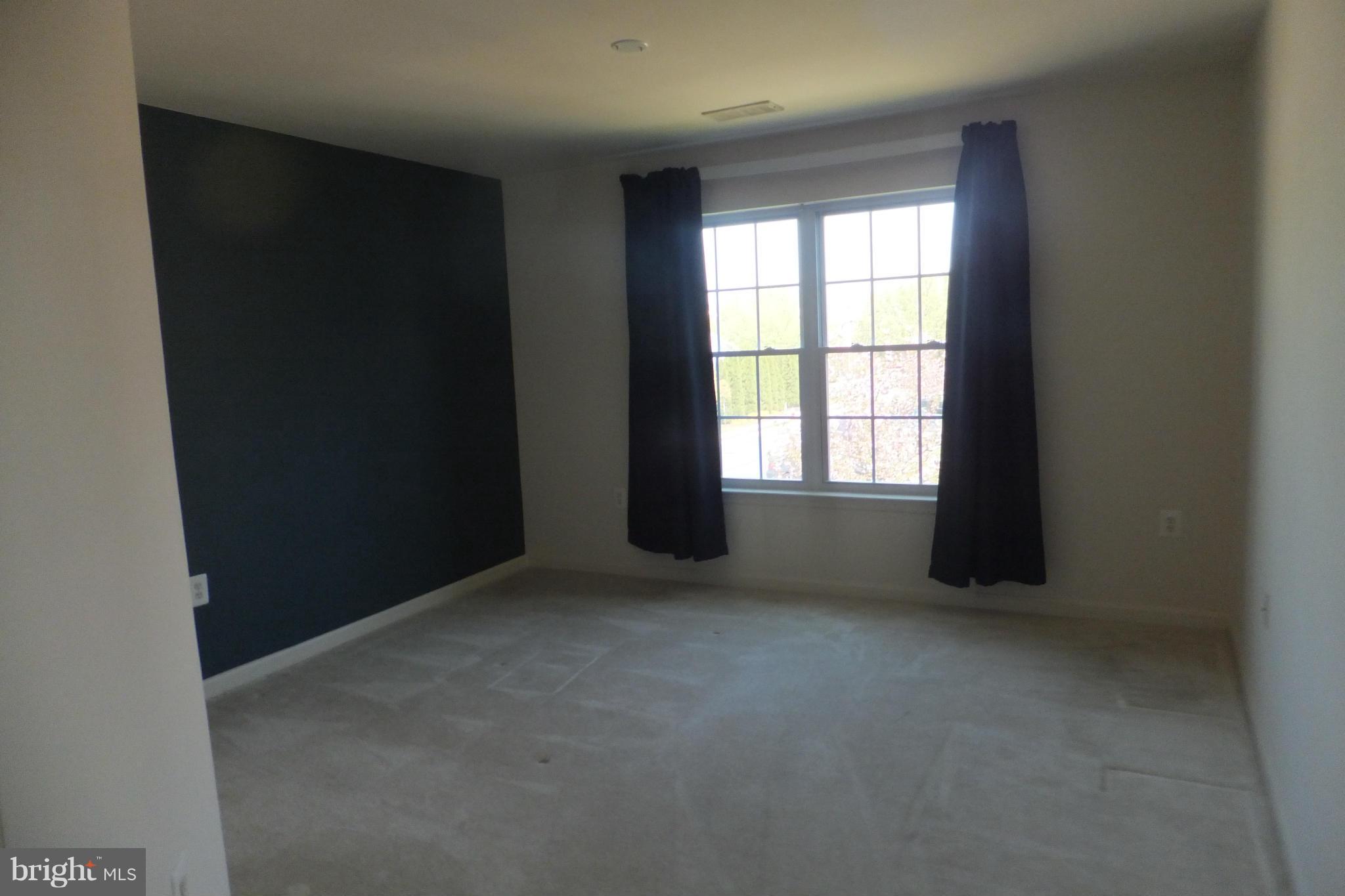 655 Constellation Square Southeast, Unit B Leesburg, VA 20175 - Photo 8 of 13 an empty room with windows