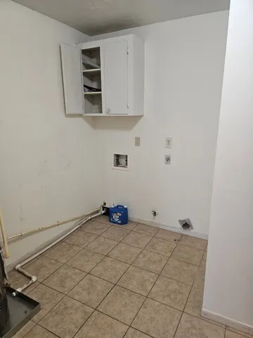 a kitchen with a sink and a window