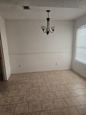 a kitchen with granite countertop a sink and a stove