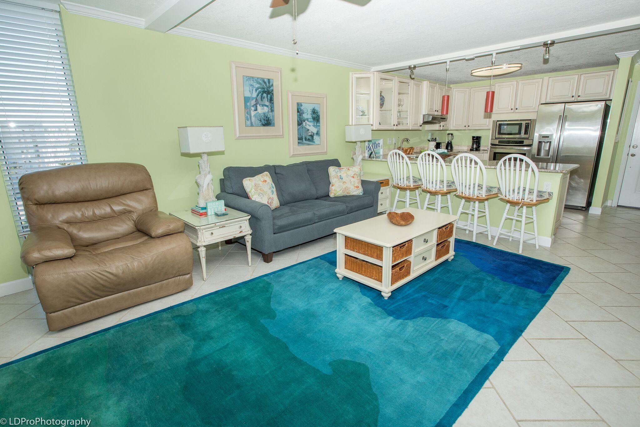 30 Moreno Point Road, Unit 601A Destin, FL 32541 - Photo 19 of 32 a living room with furniture and a wooden floor
