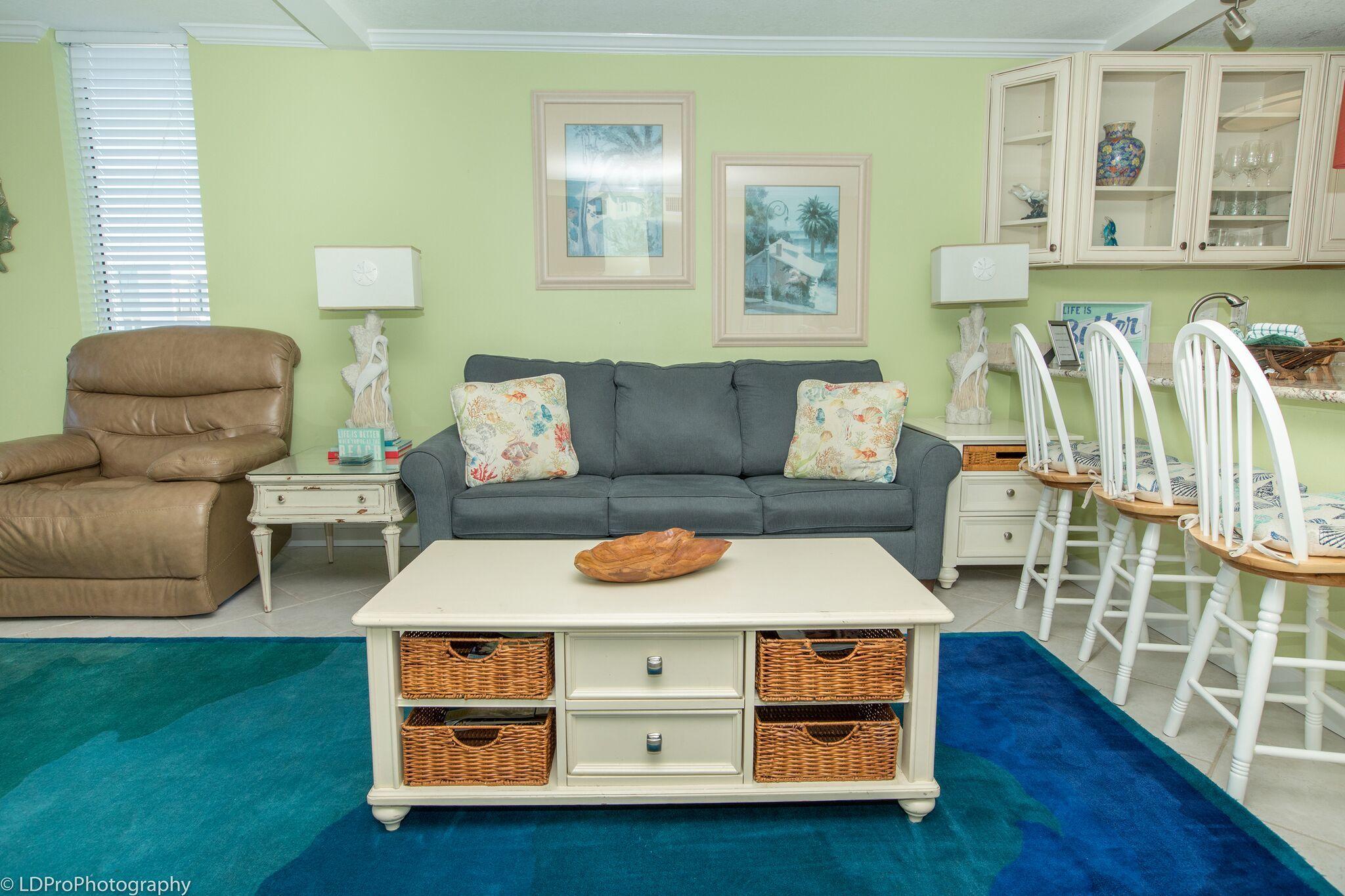 30 Moreno Point Road, Unit 601A Destin, FL 32541 - Photo 20 of 32 a living room with furniture and a wooden floor